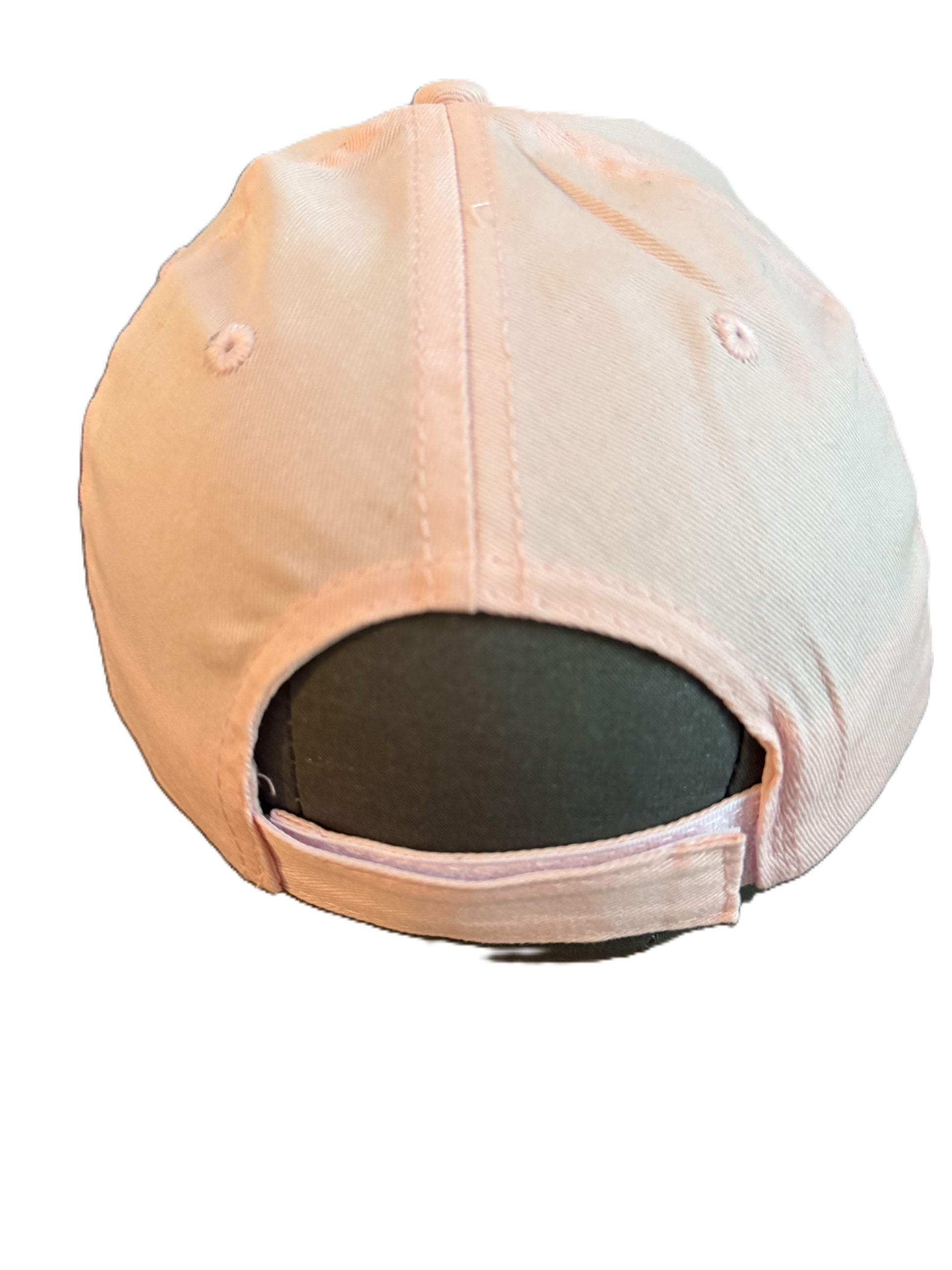 Rear view of a light pink baseball cap with stitched panels, ventilation holes, and an adjustable strap closure. Roxzell