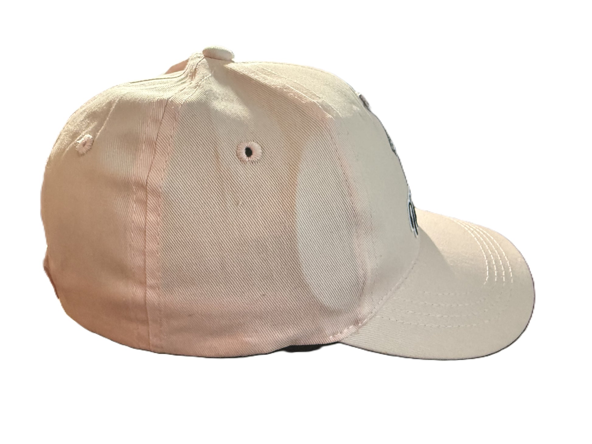 Angled view of a pink baseball cap highlighting the curved brim, stitched seams, and partial front embroidery of Minnie Mouse.