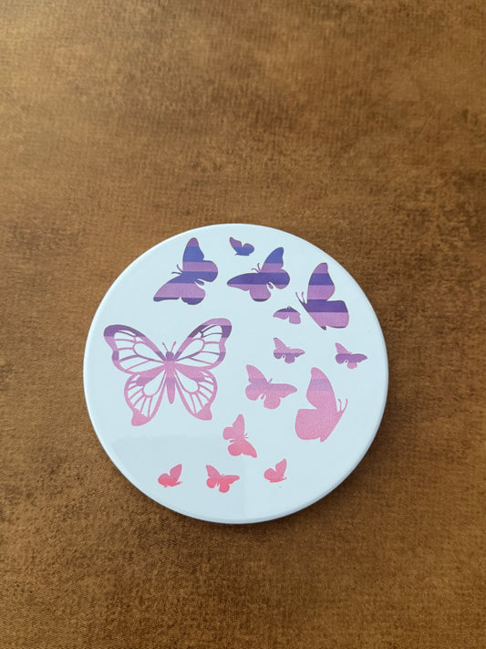 Round ceramic whit coaster designed with pink and purple butterflies.