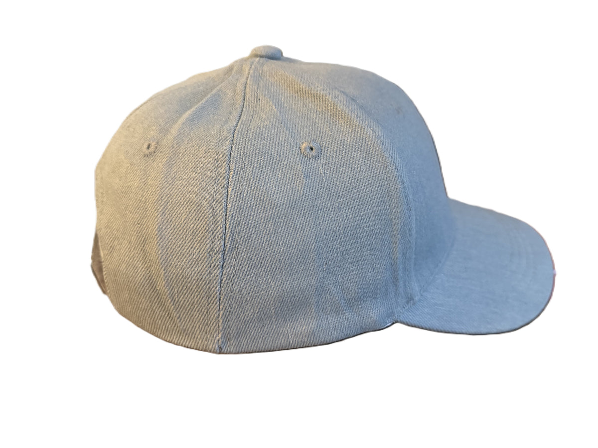 Side view of light blue denim cap showing stitching and green faith symbol