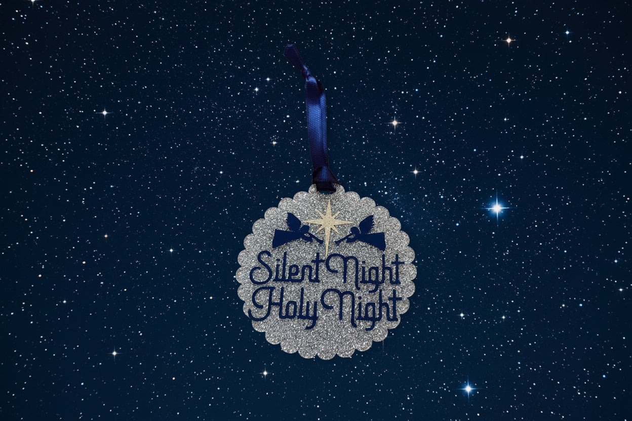 Decorative ornament with 'Silent Night Holy Night' text on a blue starry background, Roxzell