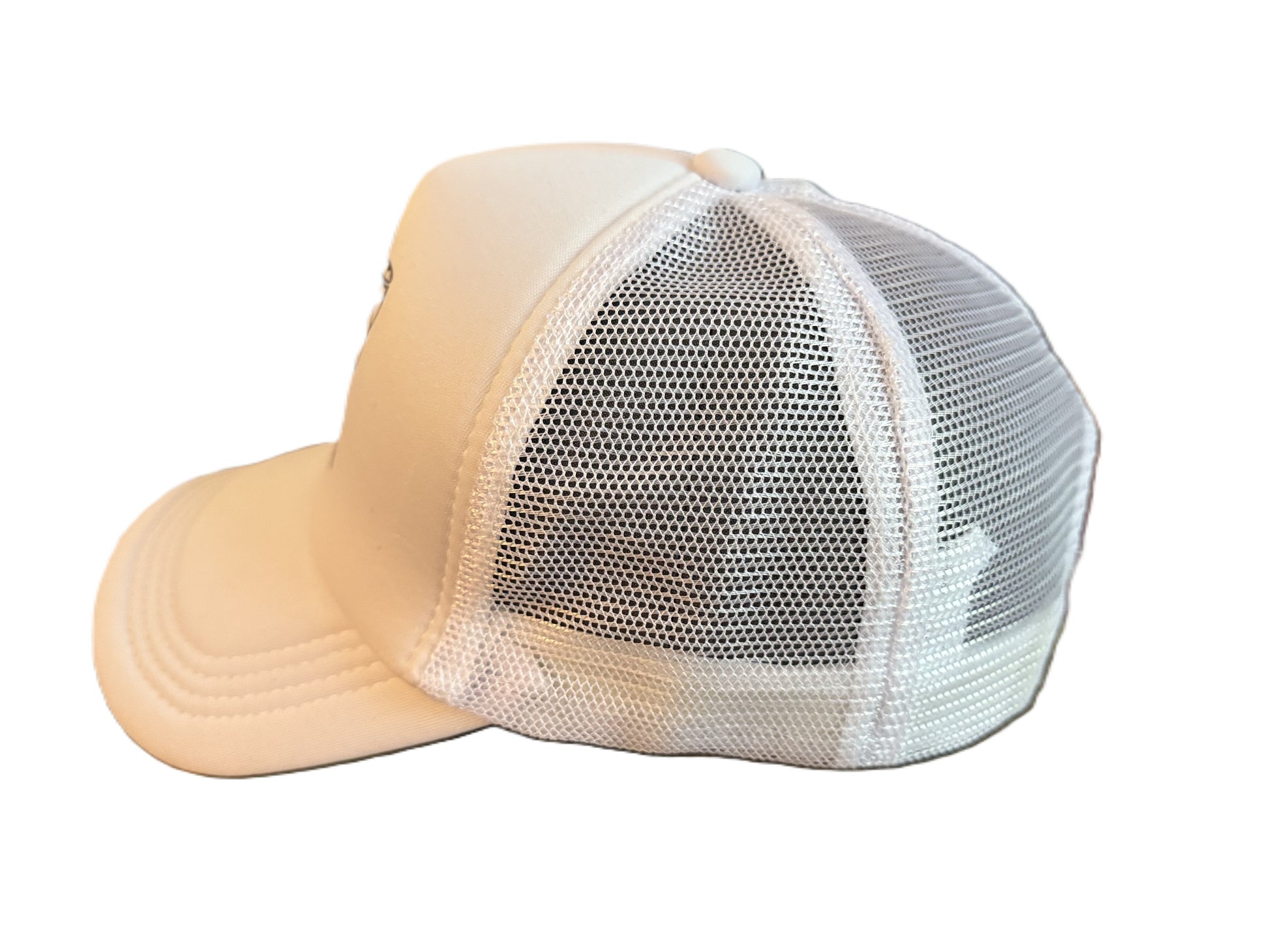 Left side view of a white mesh-back soccer ball bow pattern hat showing the breathable material and curved brim.