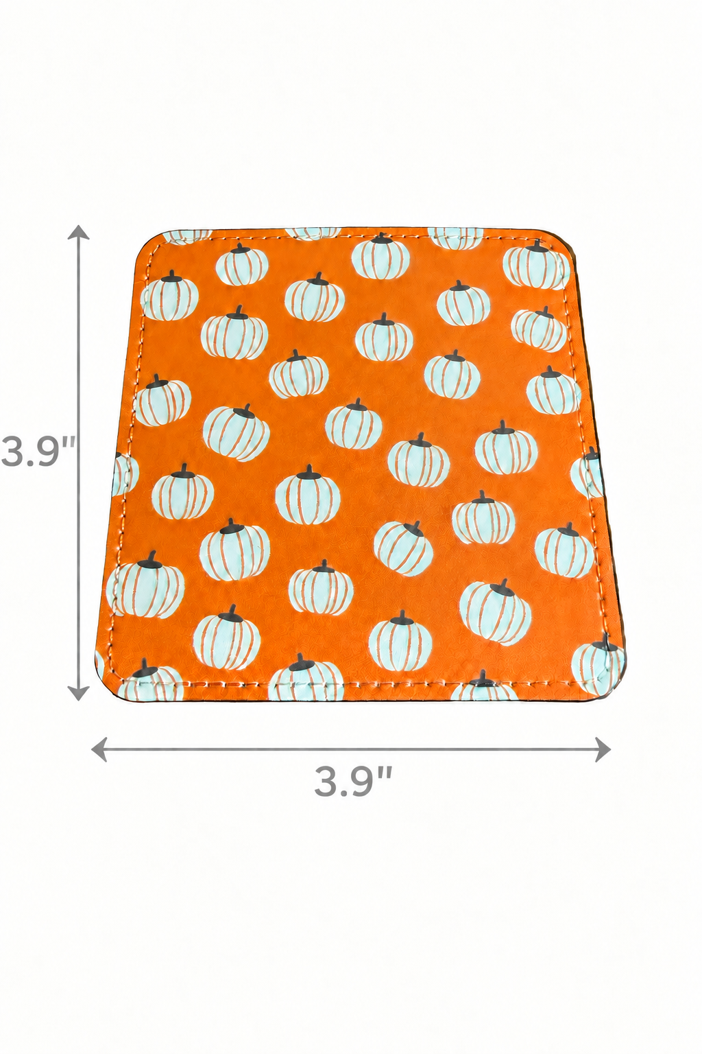 A square orange coaster with a repeating white pumpkin design, shown on a white background with dimension arrows and labels indicating 3.9 inches by 3.9 inches. Roxzell