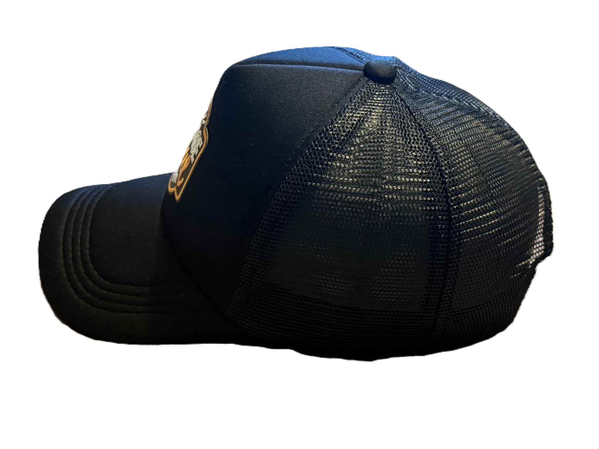 Left side view of black Vintage Soul trucker hat showing mesh back and curved brim. Roxzell
