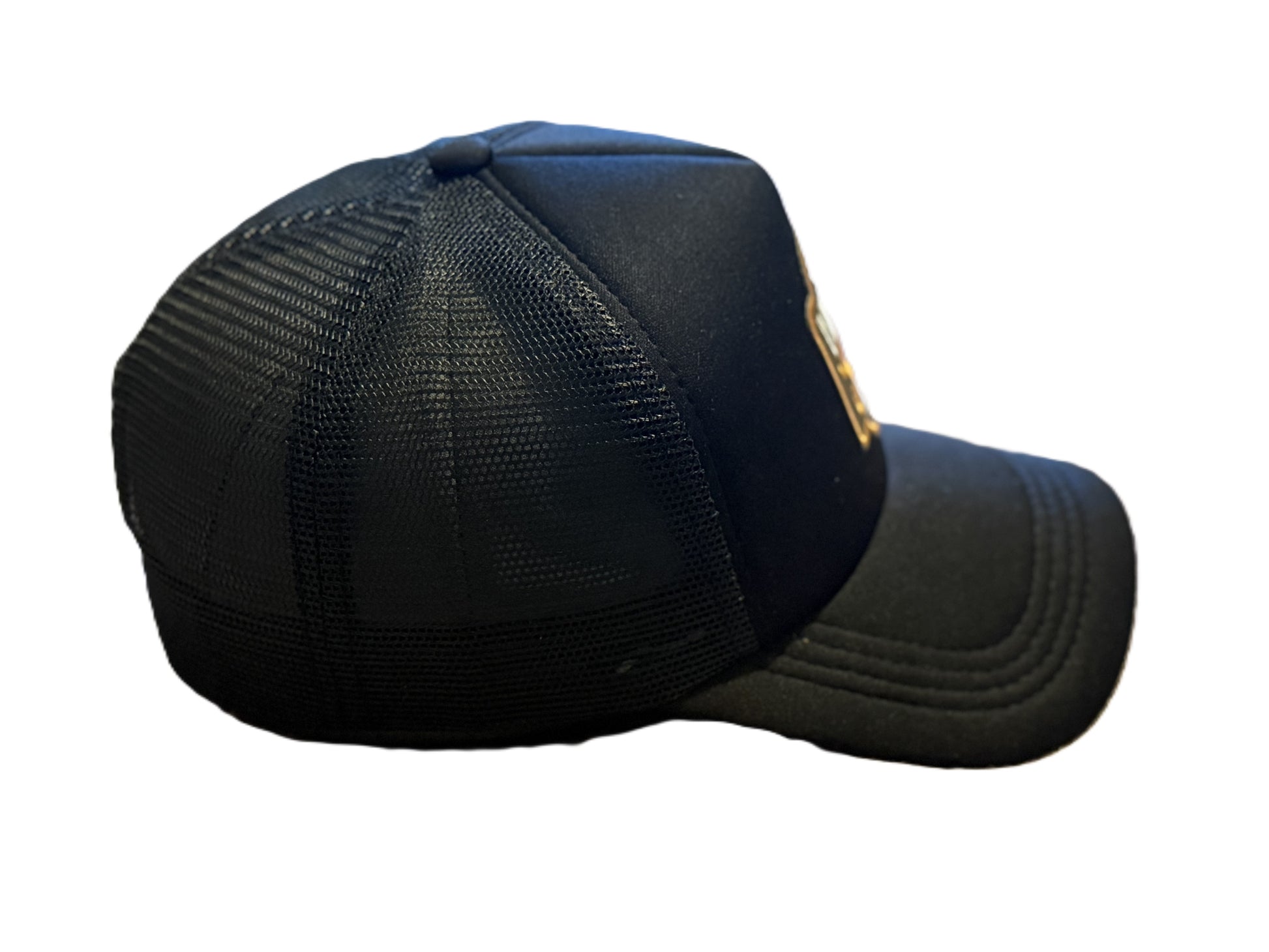 Right side view of black Vintage Soul trucker hat showing mesh back and curved brim. Roxzell