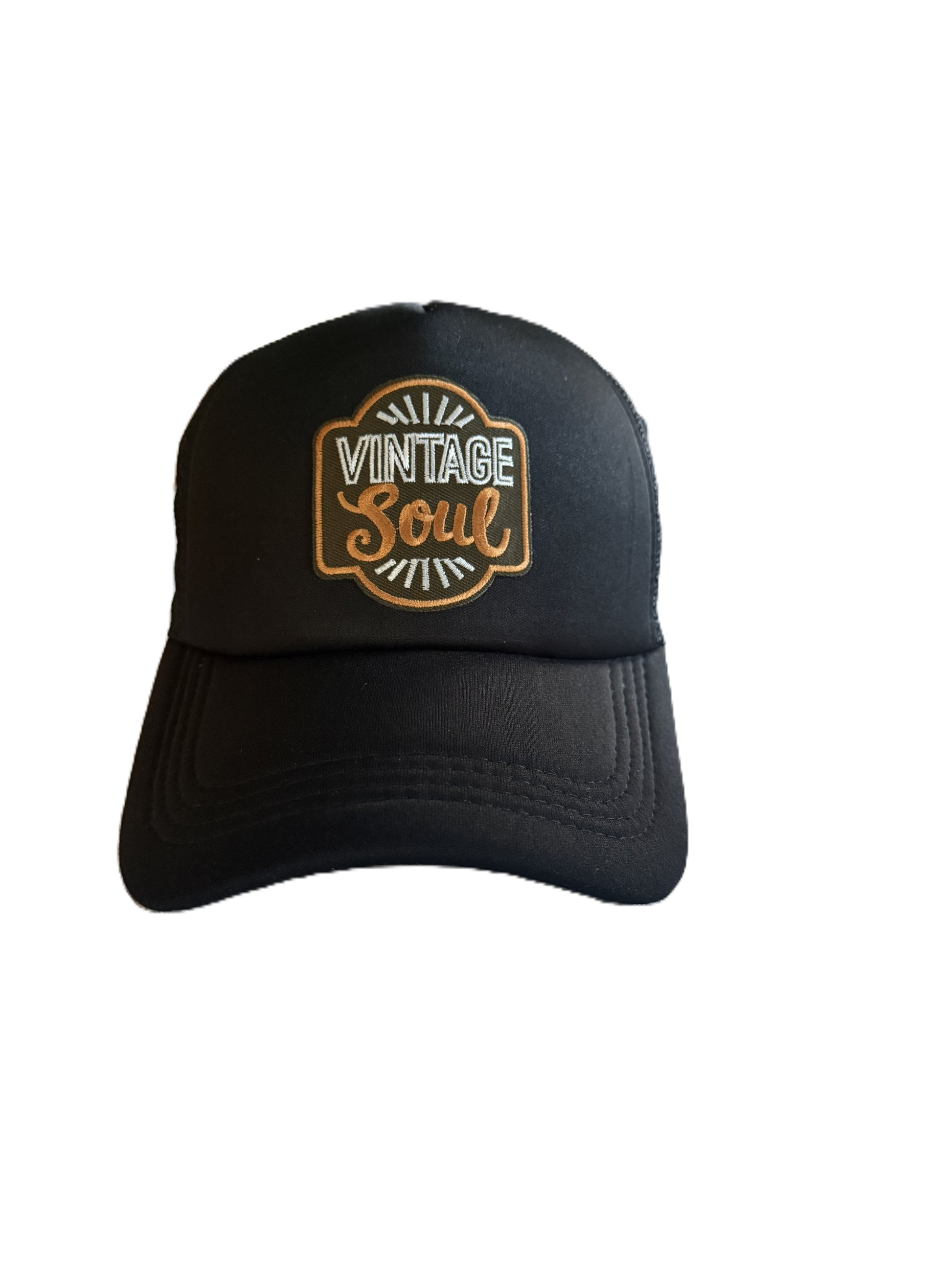 A black baseball cap featuring an embroidered circular patch on the front with the words 'VINTAGE Soul' in white and bronze.