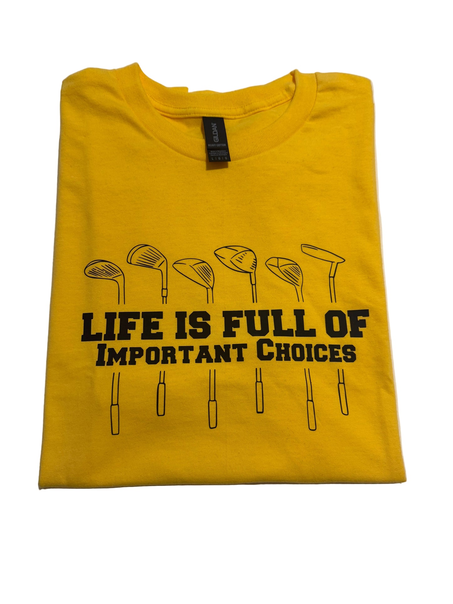 Front view of bright yellow Gildan golf t-shirt with bold navy-blue Life is Full of Important Choices and golf clubs on white background.