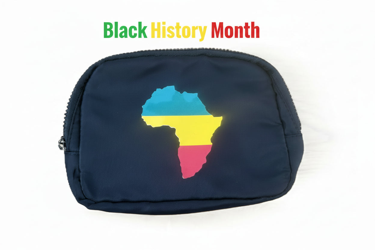 Black zippered pouch featuring a stylized Africa silhouette in green, yellow, and red horizontal color bands. Roxzell