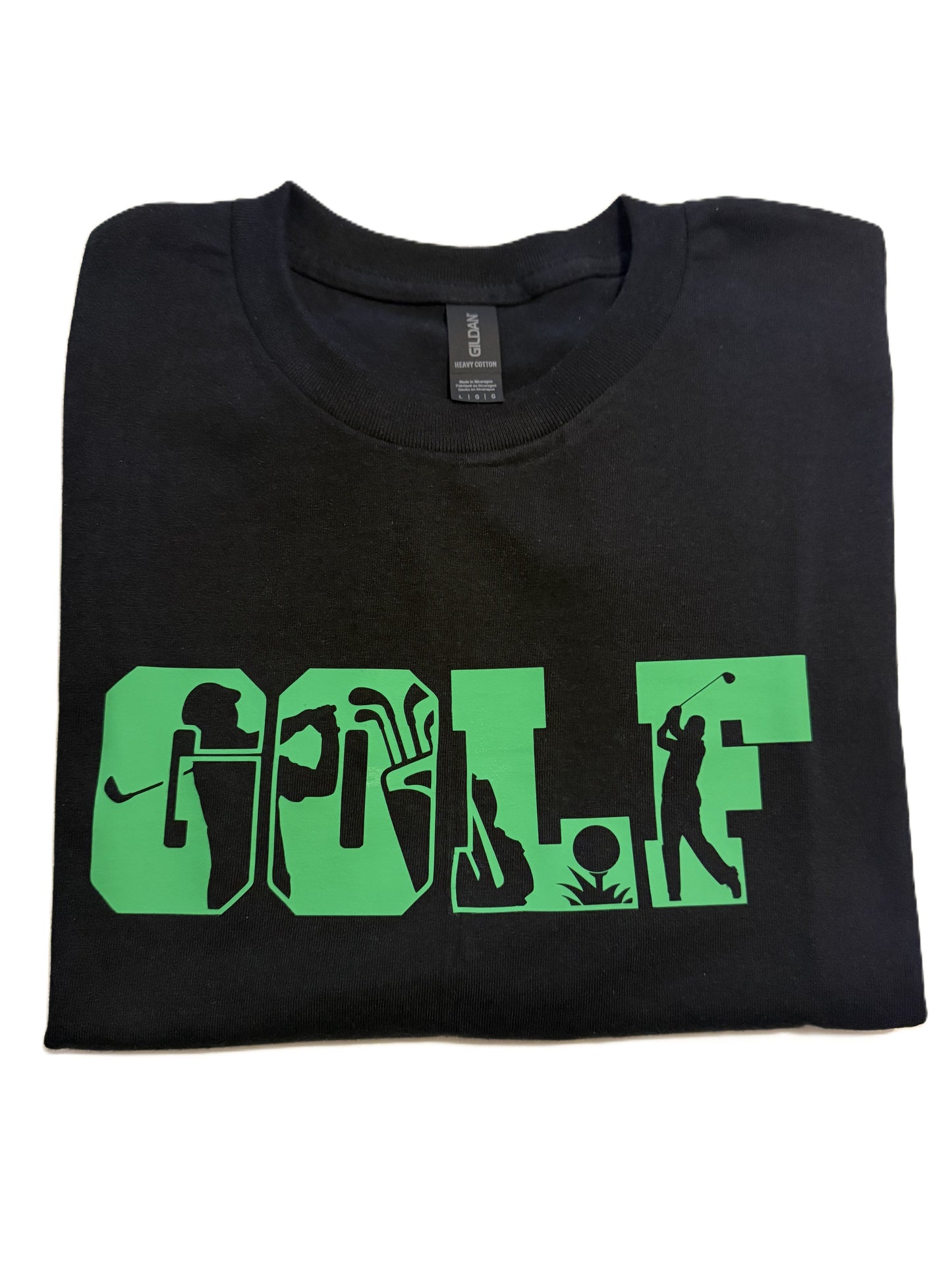 Folded black t-shirt with green golf silhouette design across the chest.