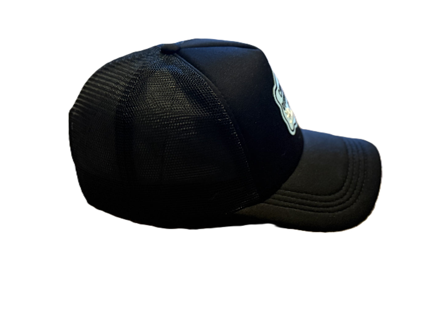 Right side view of black trucker hat with “Chronic Overthinkers Club” embroidered patch. Roxzell