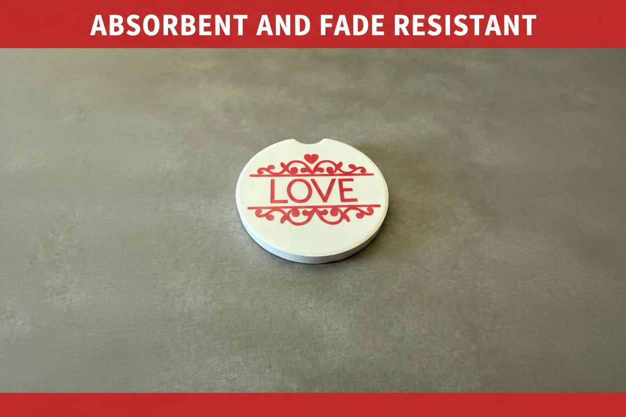 Red and white 'Love' car coaster on a gray background with red top and bottom borders, text "ABSORBENT AND FADE RESISTANT" inside top border, Roxzell