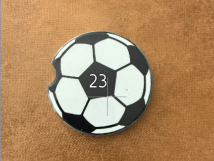 Soccer ball design car coaster with customizable number 23 on a brown background, Roxzell