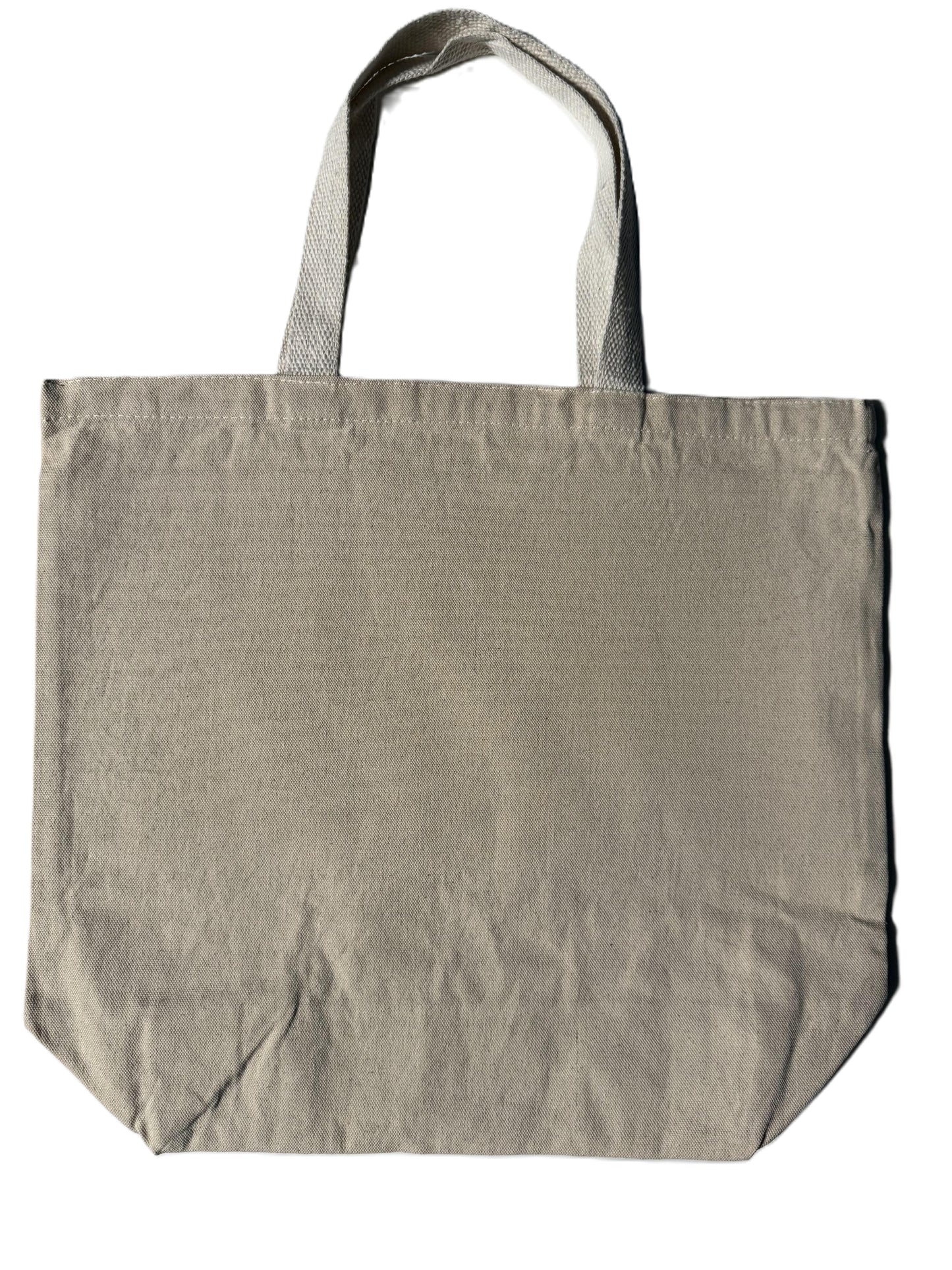 Reverse side of KC tote bag with blue collegiate lettering, Roxzell