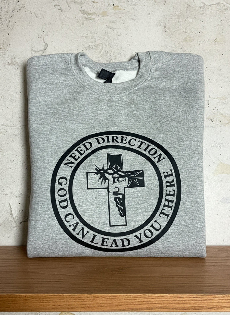 Unisex gray sweatshirt with spiritual design—cross, Jesus crowned with thorns, and motivational need direction design on a shelf, Roxzell