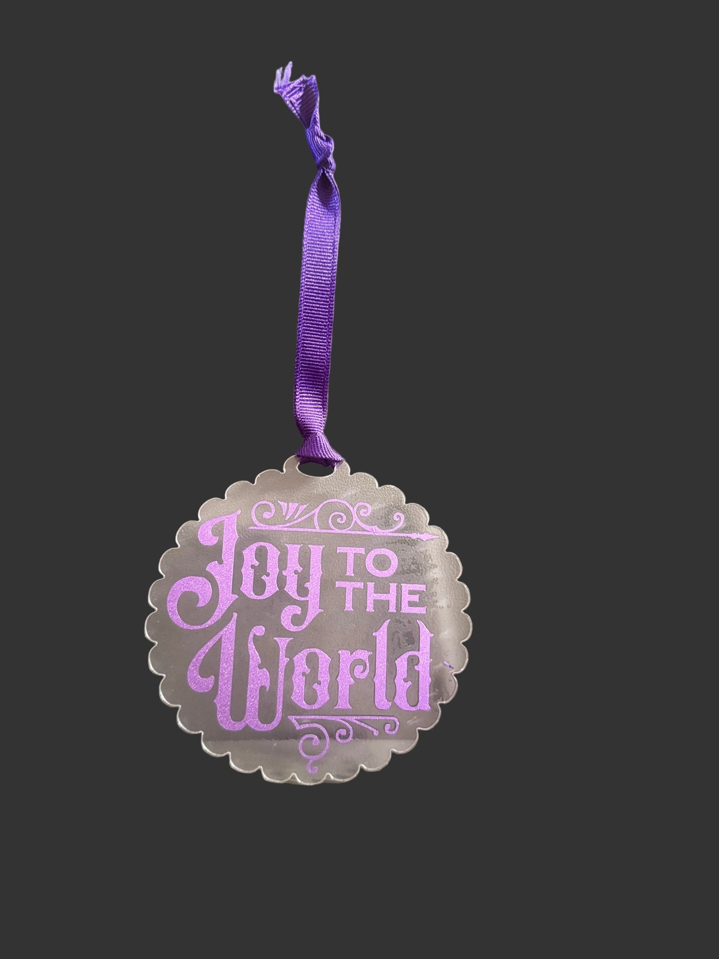Joy to the World Christmas ornament with purple hanging ribbon on a gray background, Roxzell
